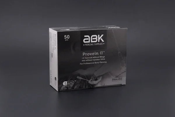 ABK piercing cannula box on a charcoal background