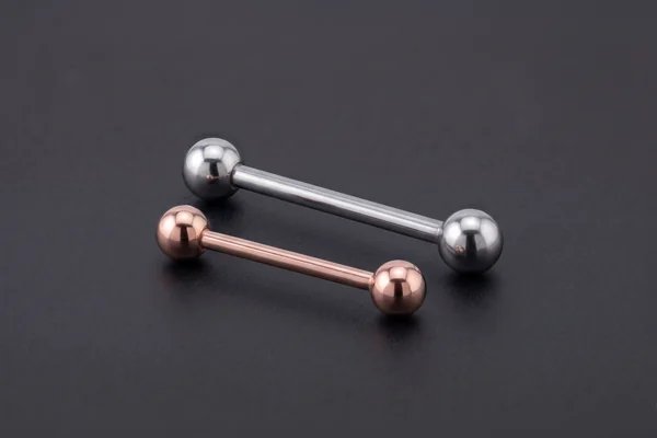 Silver and rose-gold straight barbells with ball ends